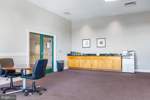 a workspace with furniture and a window