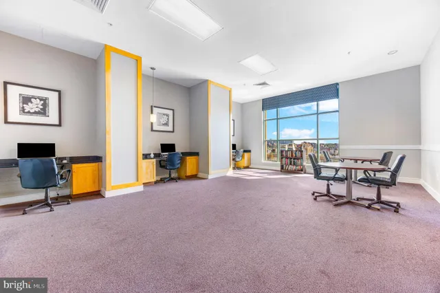 a living room with furniture and a gym