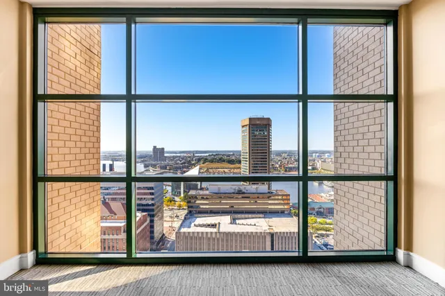 a view of a living room with furniture and window