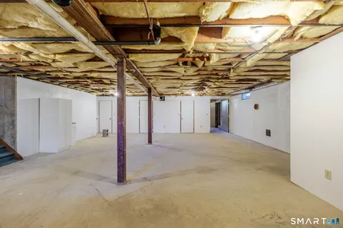 a view of a room with wooden ceiling