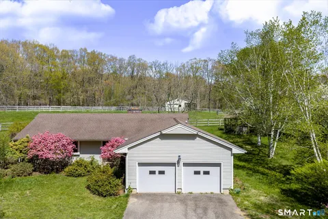 a house with trees in the background