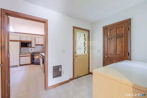 a bedroom with a bed and a view of en suite bathroom