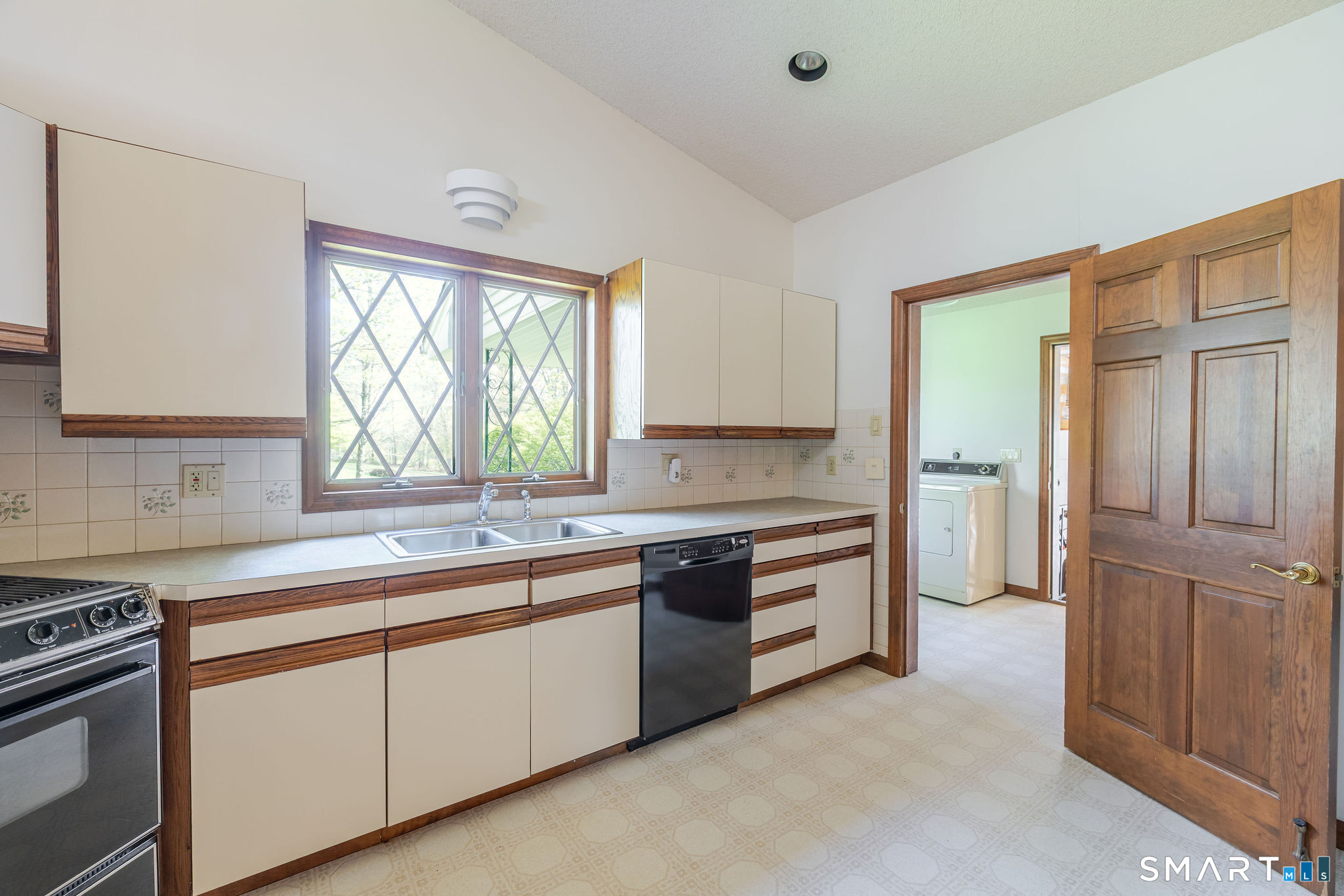 123 Mine Hill Road New Milford, CT 06776 - Photo 8 of 36 a kitchen with a sink stove and cabinets