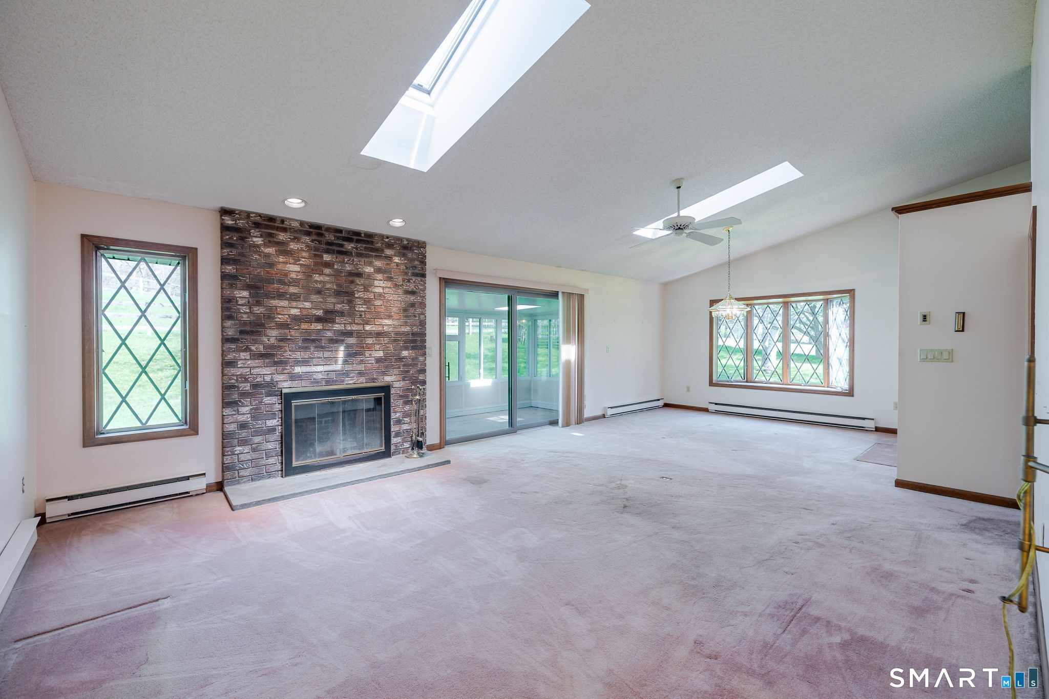123 Mine Hill Road New Milford, CT 06776 - Photo 10 of 36 a view of empty room with a fireplace