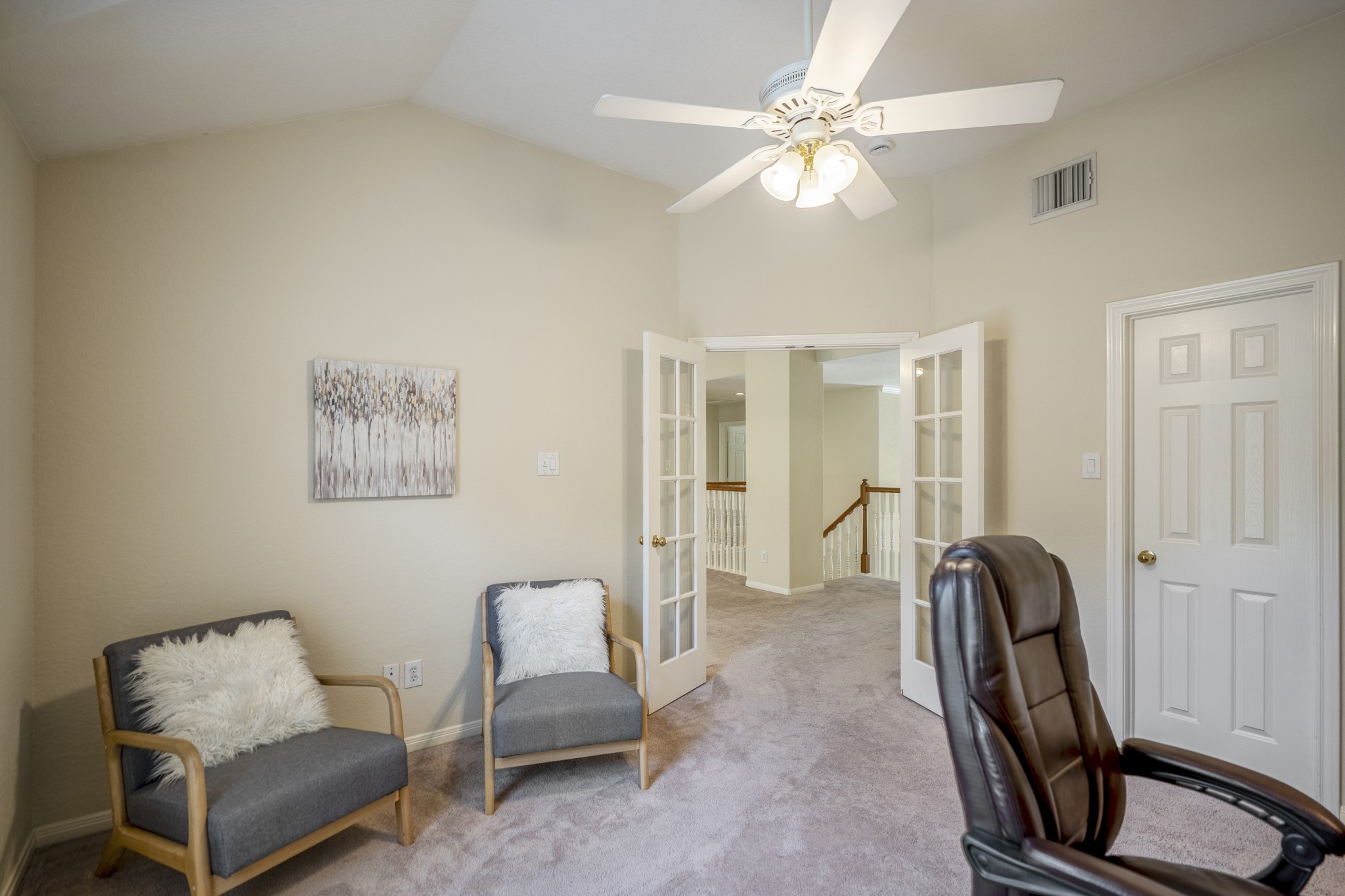 5807 Sequoia Trace Court Spring, TX 77379 - Photo 23 of 50 Looking back toward the game room, the upstairs study feels connected yet distinct, with French doors, vaulted ceilings, and a layout that offers flexibility while maintaining separation from the home's shared living spaces.