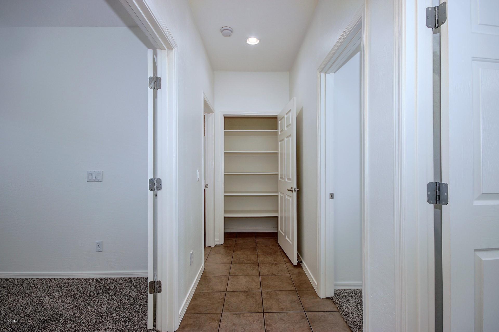 15251 West Boca Raton Road Surprise, AZ 85379 - Photo 34 of 39 15251 Boca Raton-Hallway & Storage close