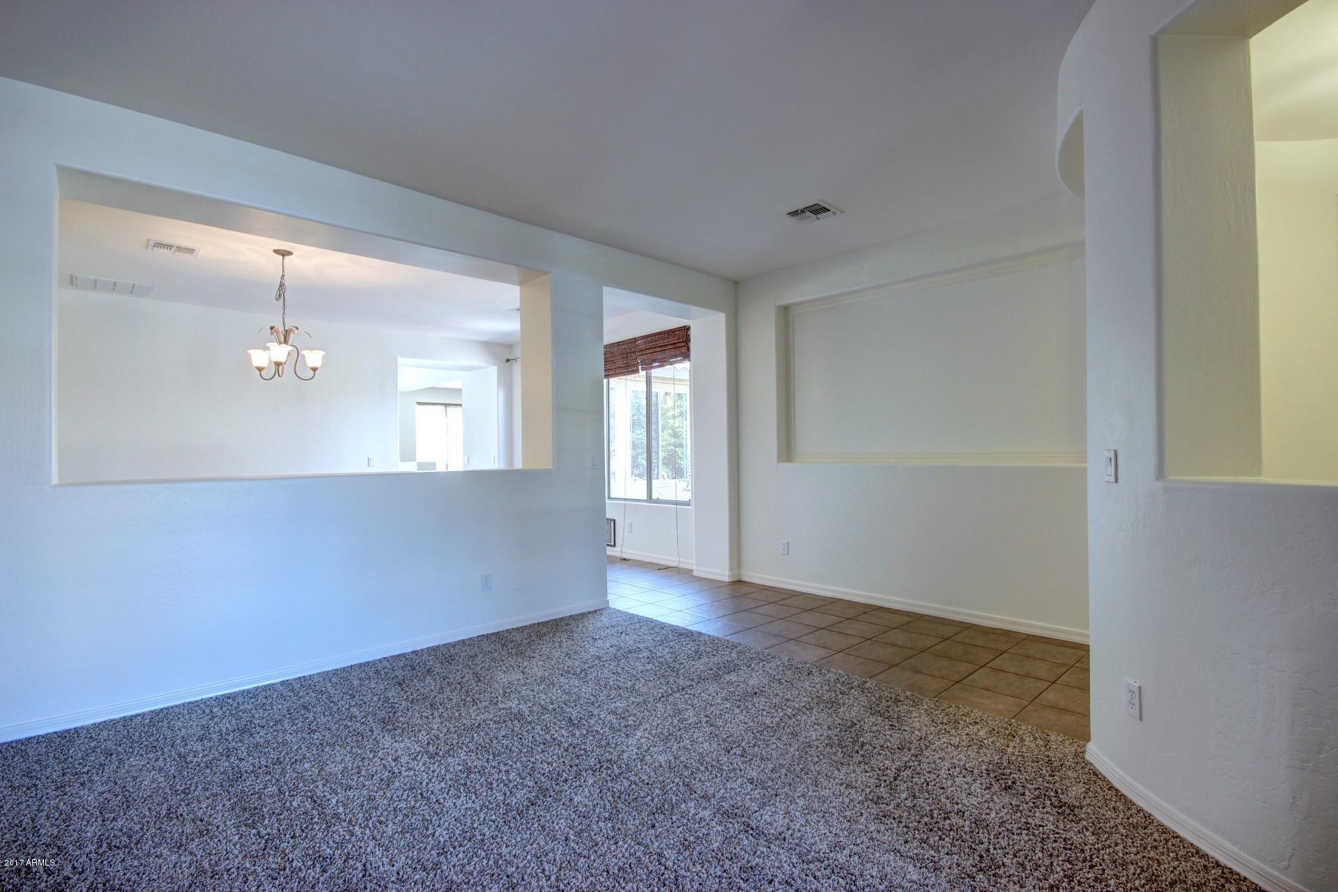 15251 West Boca Raton Road Surprise, AZ 85379 - Photo 5 of 39 15251 Boca Raton-Living Rm Front