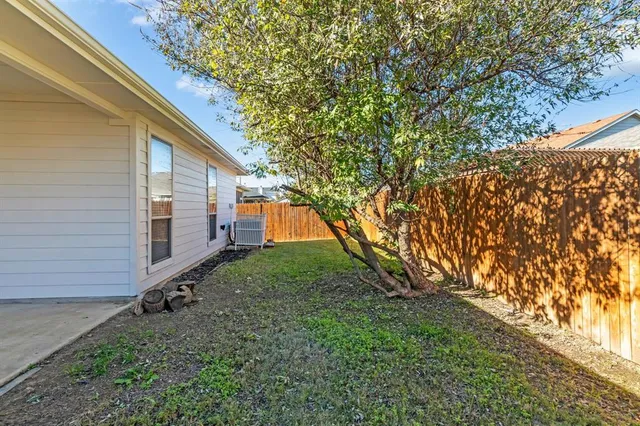 a backyard of a house with lots of green space