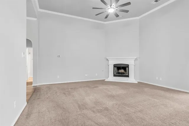 a view of an empty room with a fireplace