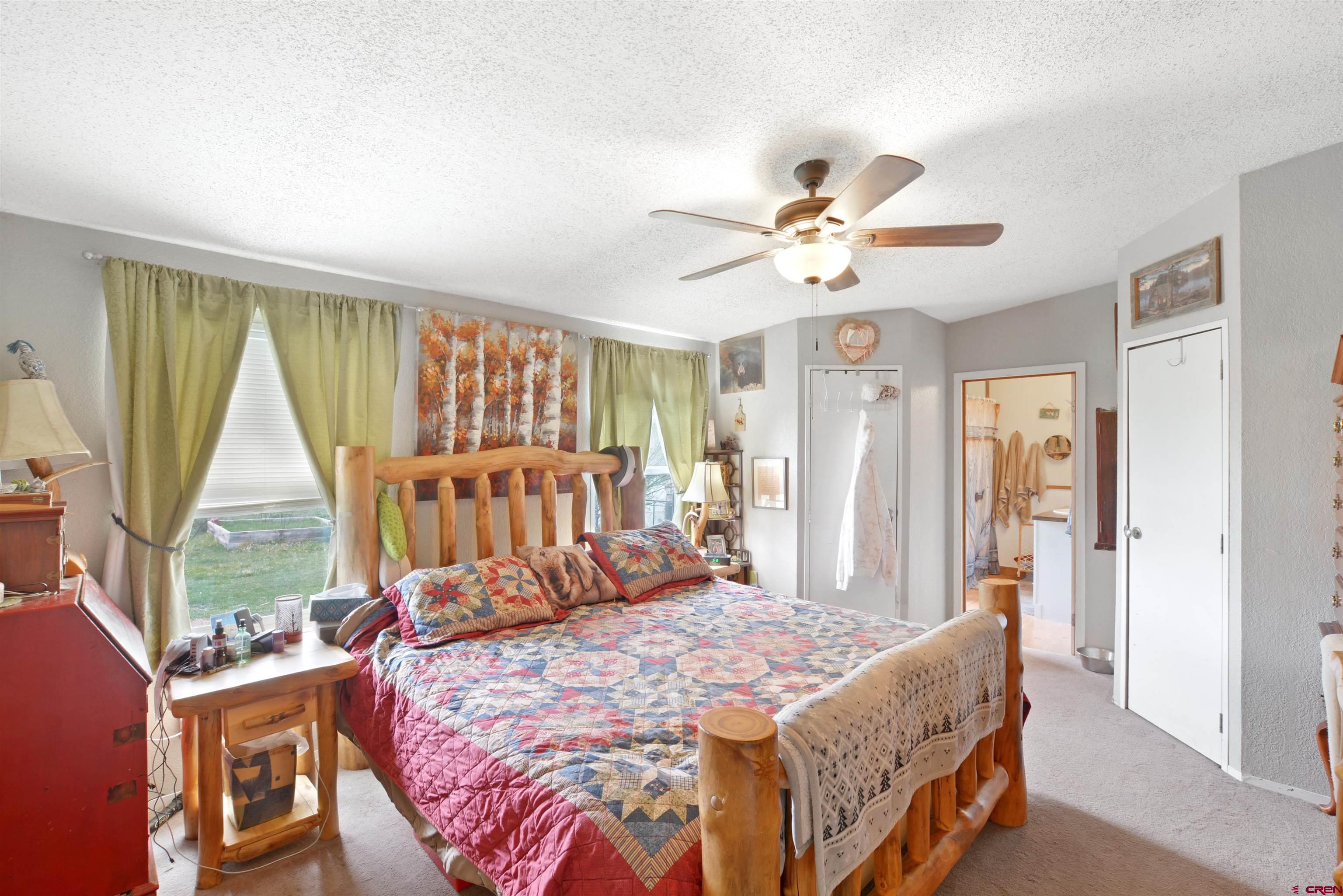 3519 County Road 311 Ignacio, CO 81137 - Photo 11 of 22 a bed room with a bed and a window