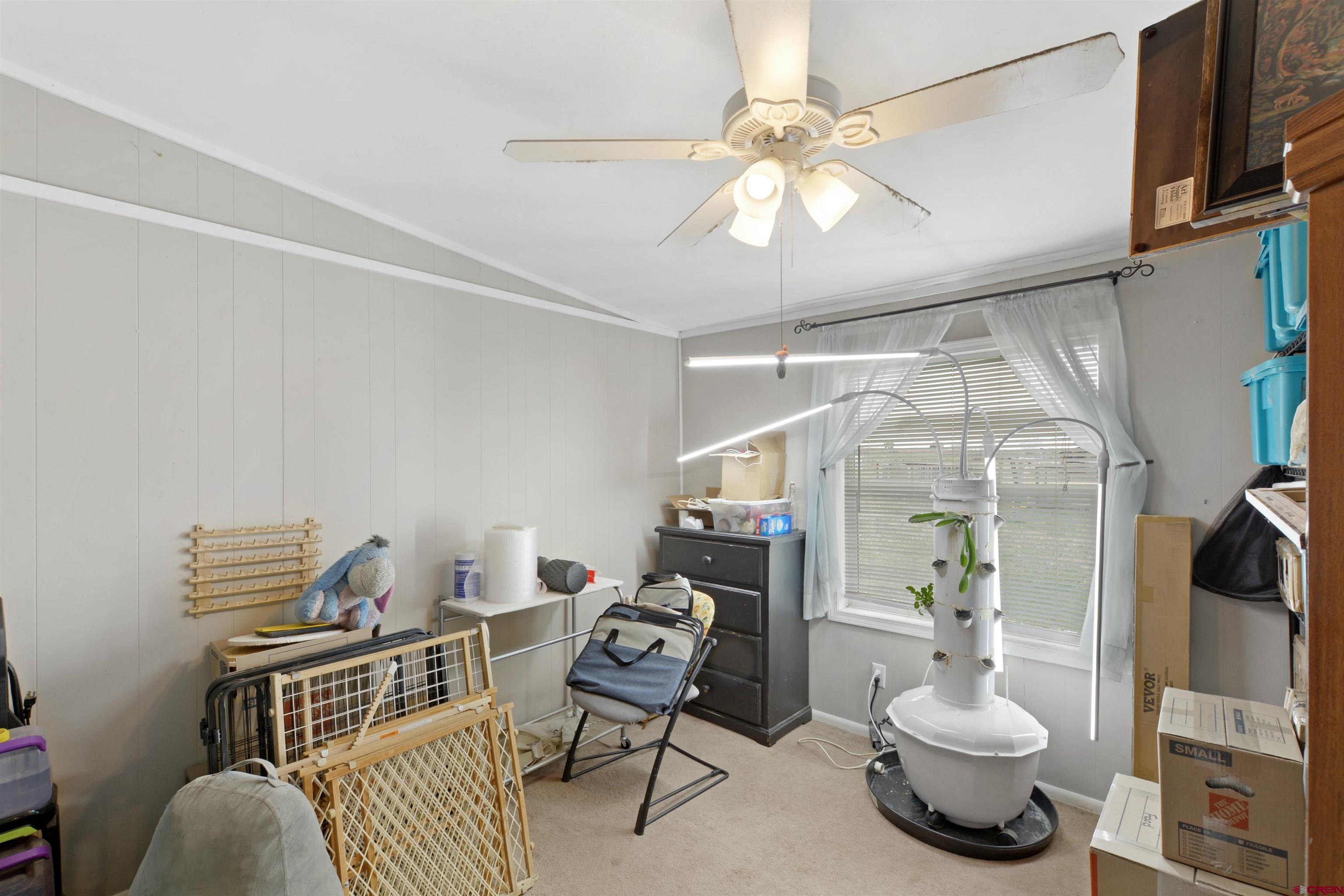 3519 County Road 311 Ignacio, CO 81137 - Photo 15 of 22 a living room with furniture and a chandelier