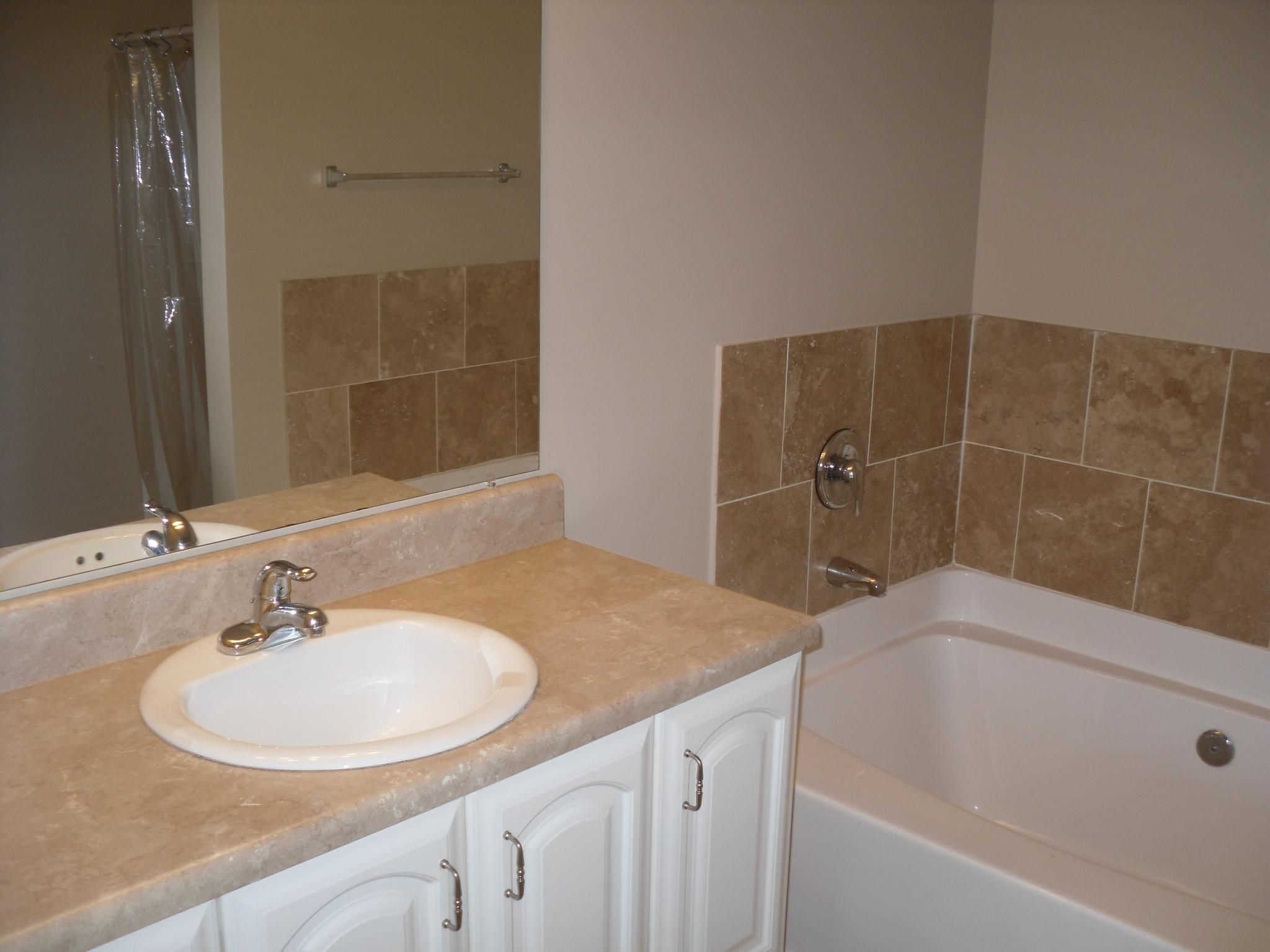703 Bay Grove Road Freeport, FL 32439 - Photo 11 of 22 a bathroom with a sink and a bathtub