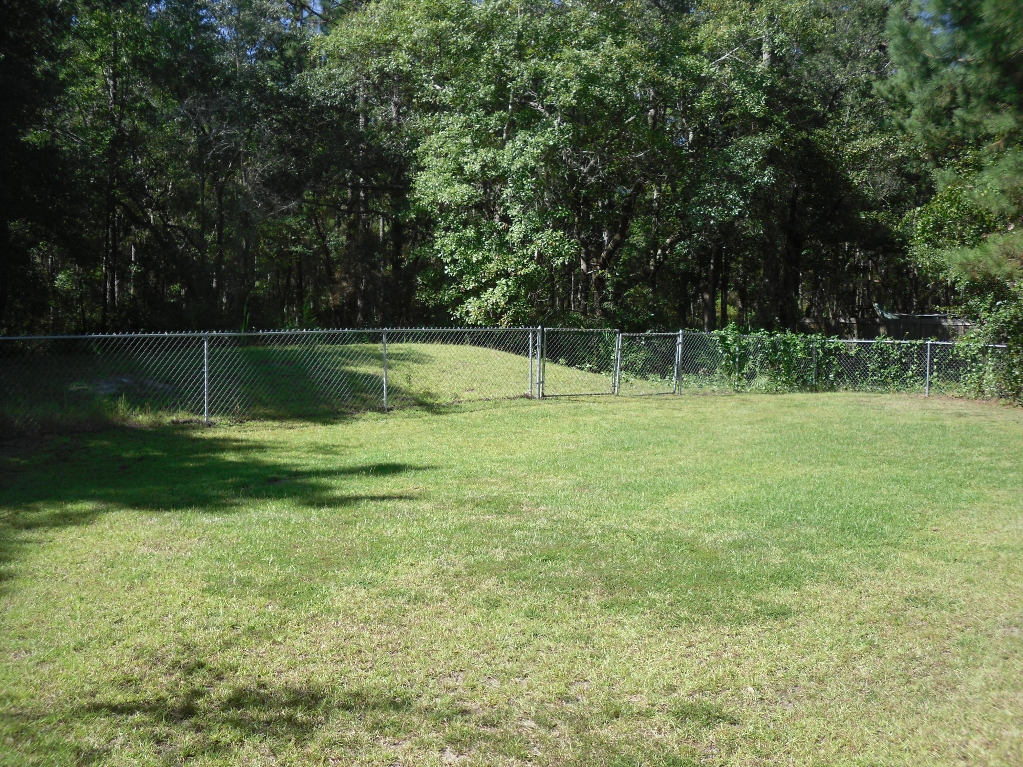 703 Bay Grove Road Freeport, FL 32439 - Photo 16 of 22 a view of swimming pool with a yard