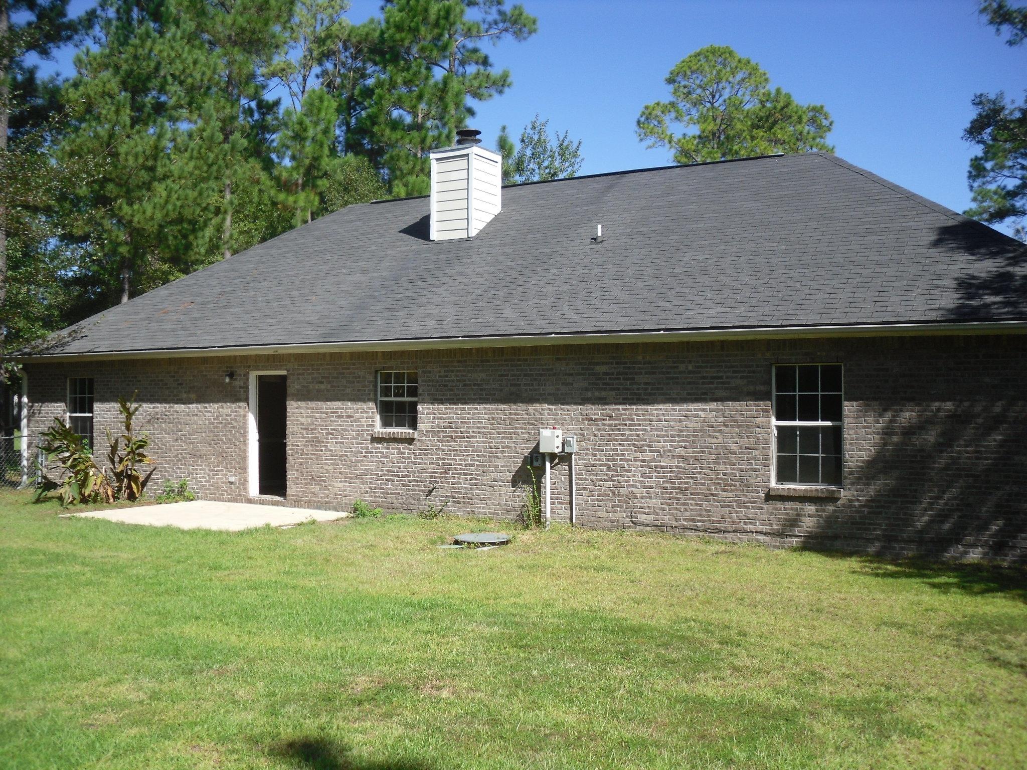 703 Bay Grove Road Freeport, FL 32439 - Photo 17 of 22 a house view with a garden space