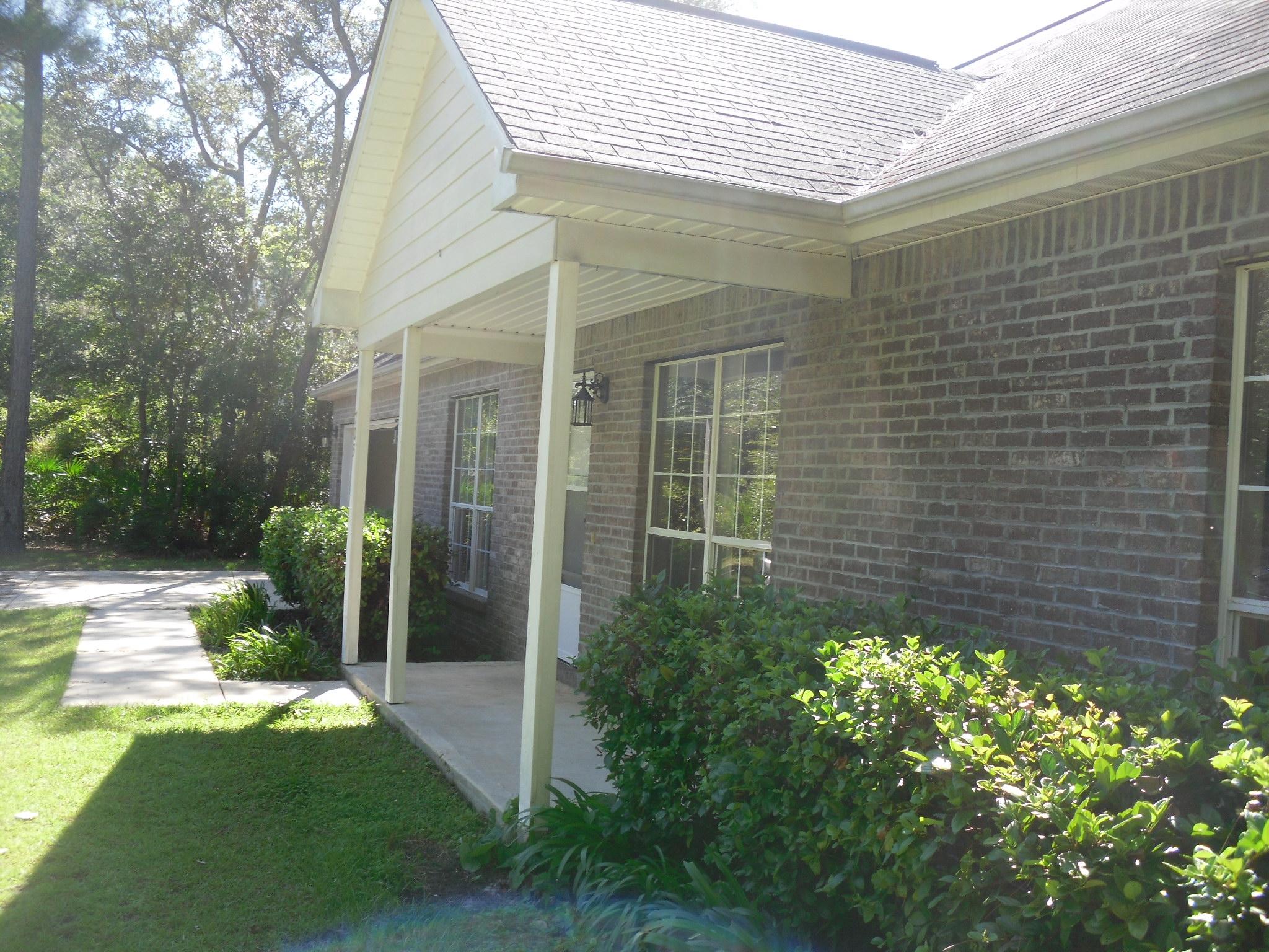 703 Bay Grove Road Freeport, FL 32439 - Photo 19 of 22 a view of a backyard with plants