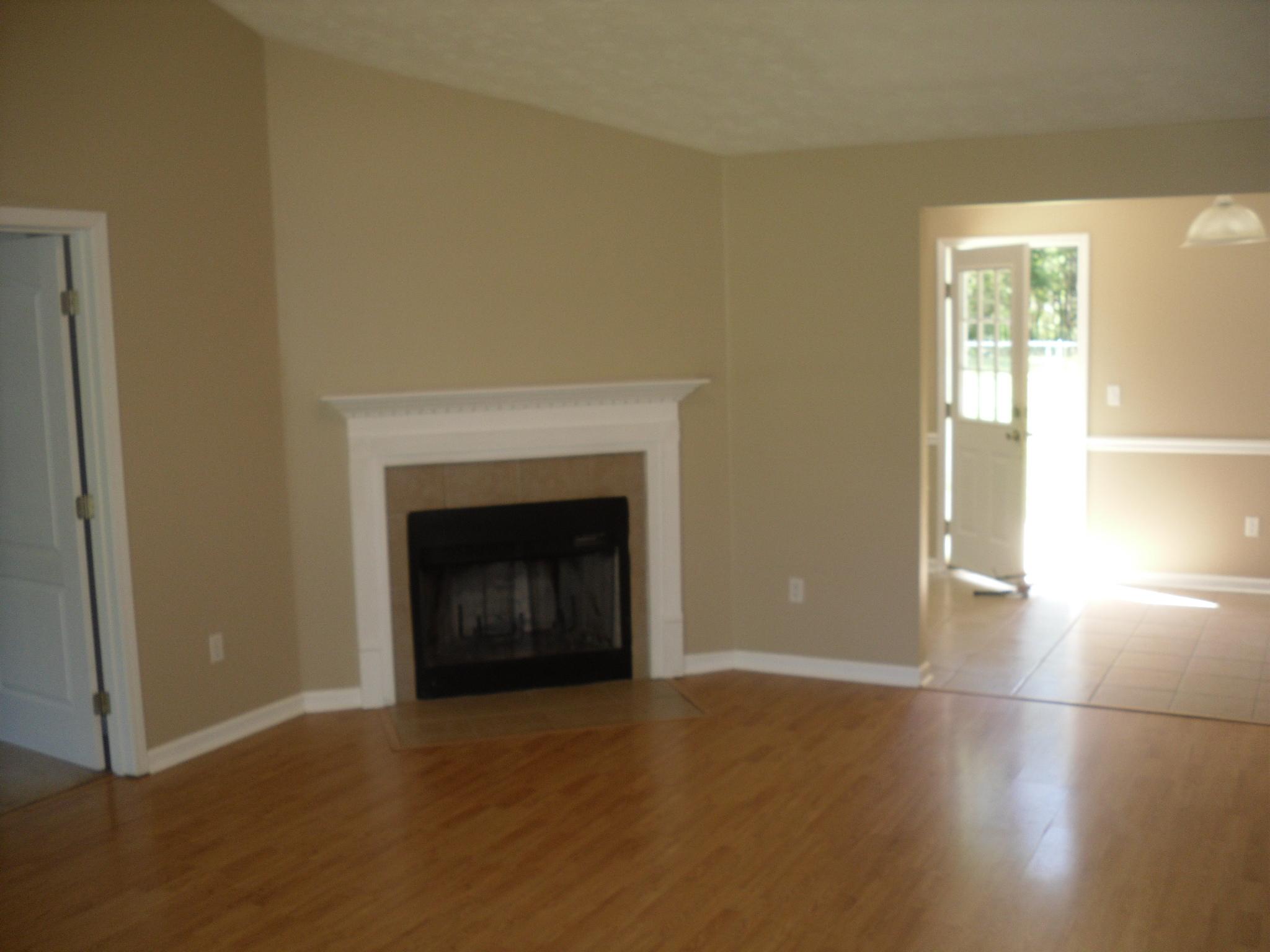 703 Bay Grove Road Freeport, FL 32439 - Photo 3 of 22 a view of an empty room with window and fire place