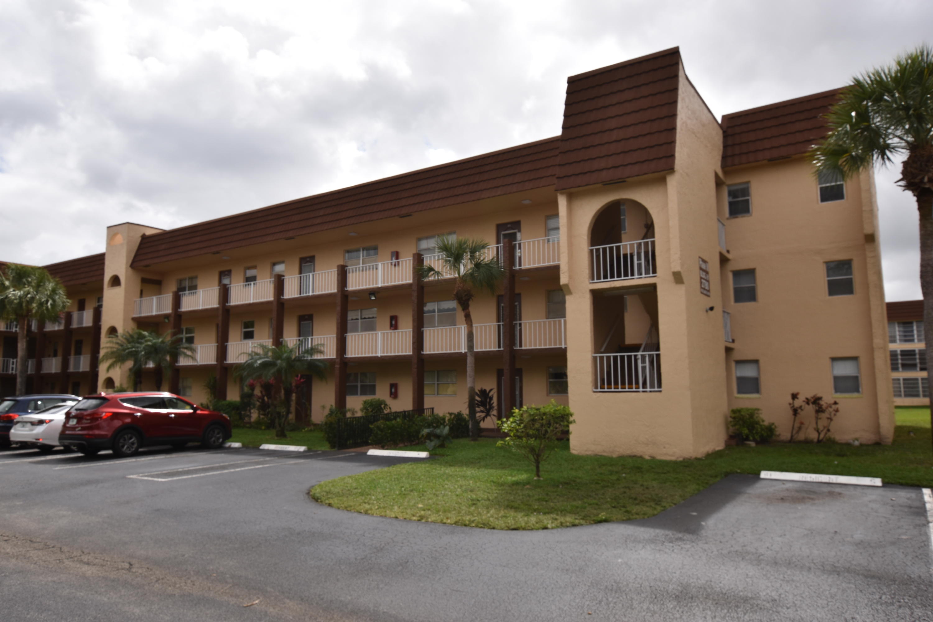 a couple of cars parked in front of a house