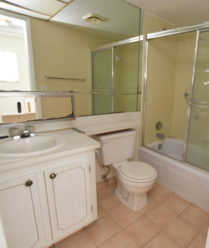2780 North Pine Island Road, Unit 312 Sunrise, FL 33322 - Photo 12 of 30 a bathroom with a sink toilet and shower