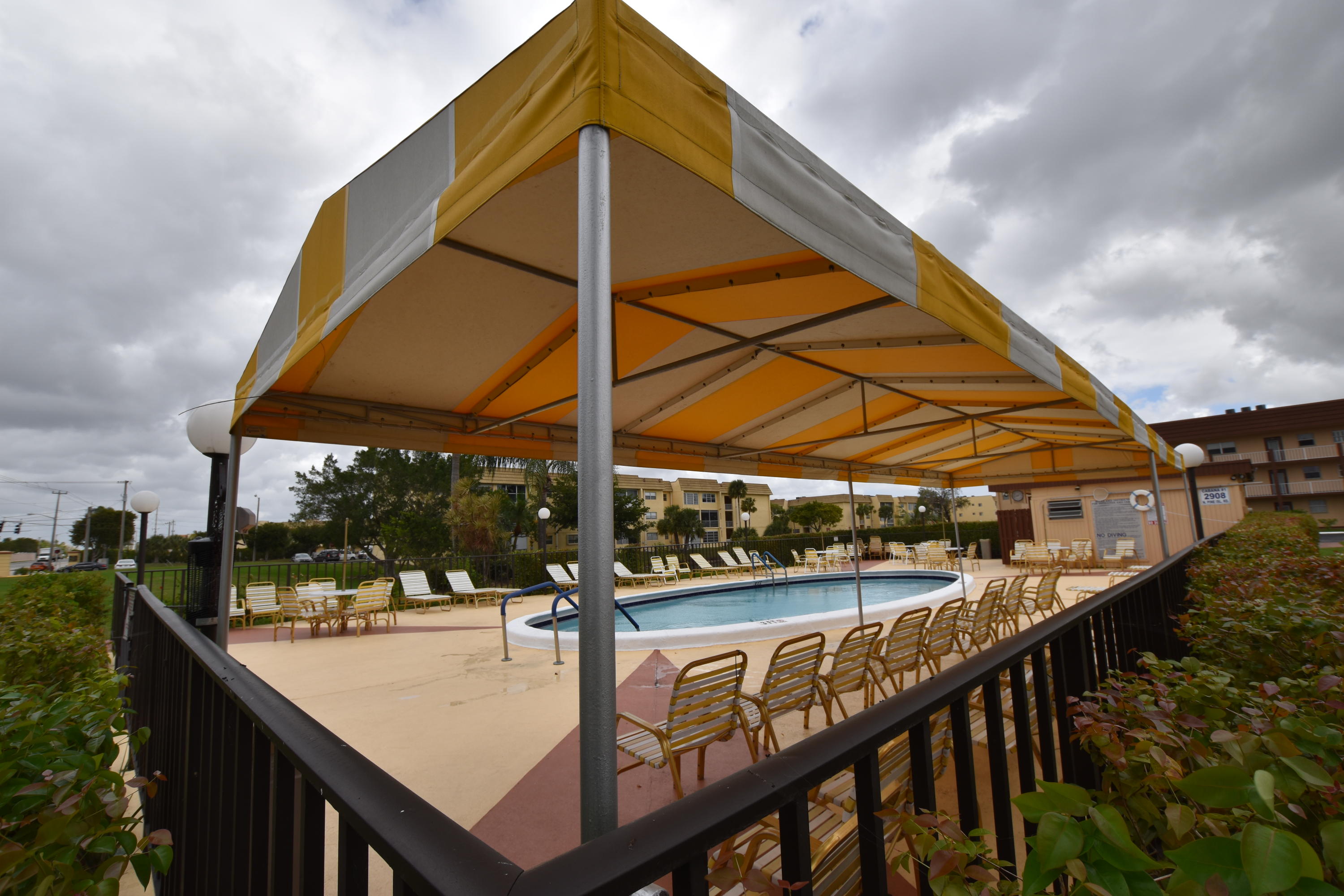 2780 North Pine Island Road, Unit 312 Sunrise, FL 33322 - Photo 16 of 30 a view of a swimming pool with a patio