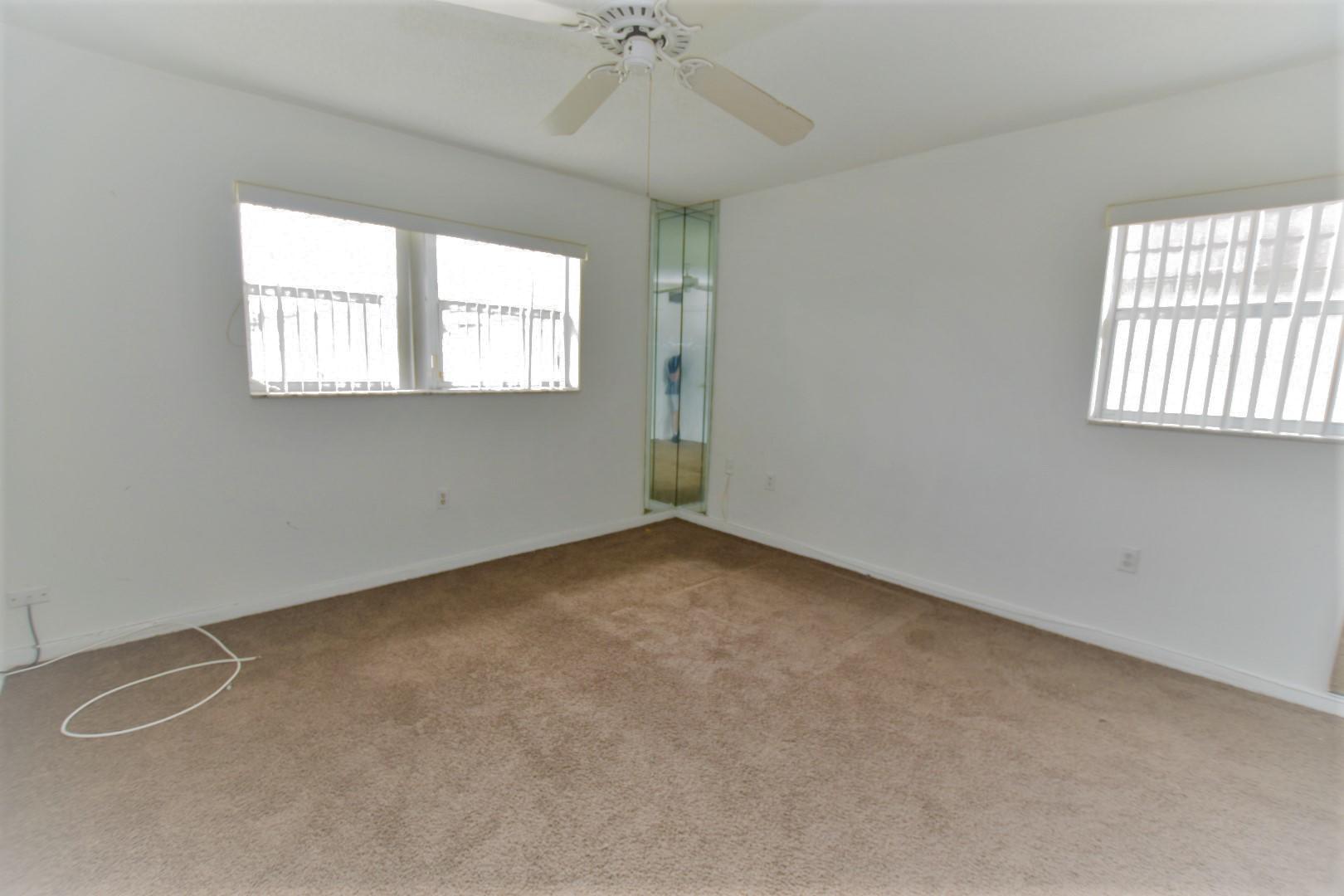 2780 North Pine Island Road, Unit 312 Sunrise, FL 33322 - Photo 6 of 30 an empty room with a window