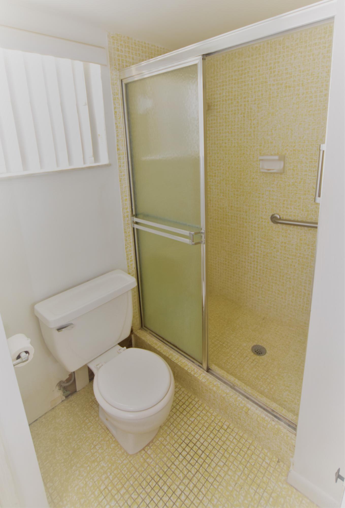2780 North Pine Island Road, Unit 312 Sunrise, FL 33322 - Photo 9 of 30 a bathroom with a toilet and shower
