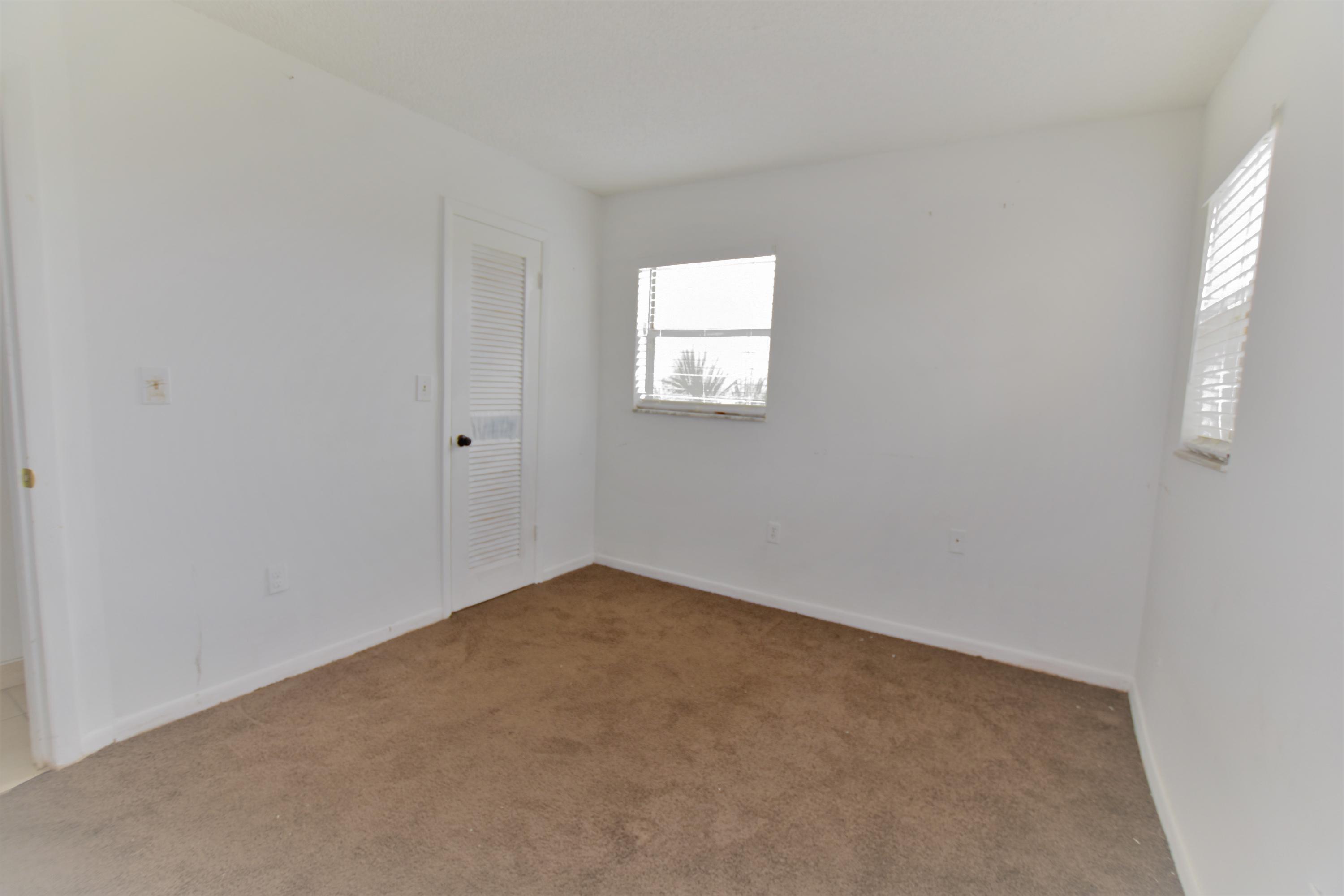 2780 North Pine Island Road, Unit 312 Sunrise, FL 33322 - Photo 10 of 30 an empty room with a window