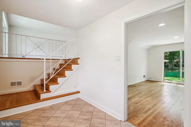 a view of an entryway with wooden floor