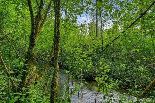 a view of swimming pool with a patio