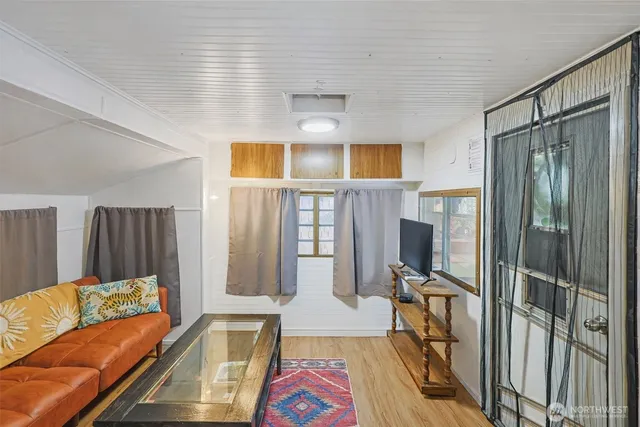 a living room with furniture fireplace and flat screen tv