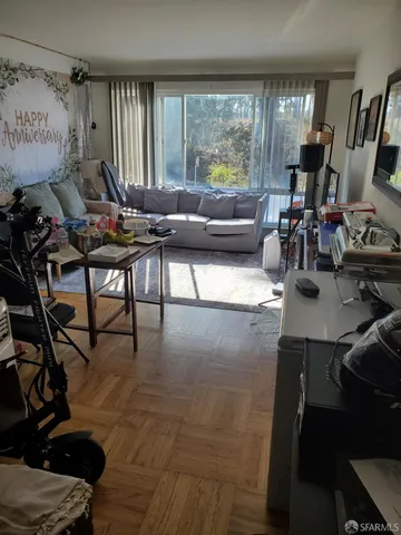 a living room with furniture and a large window