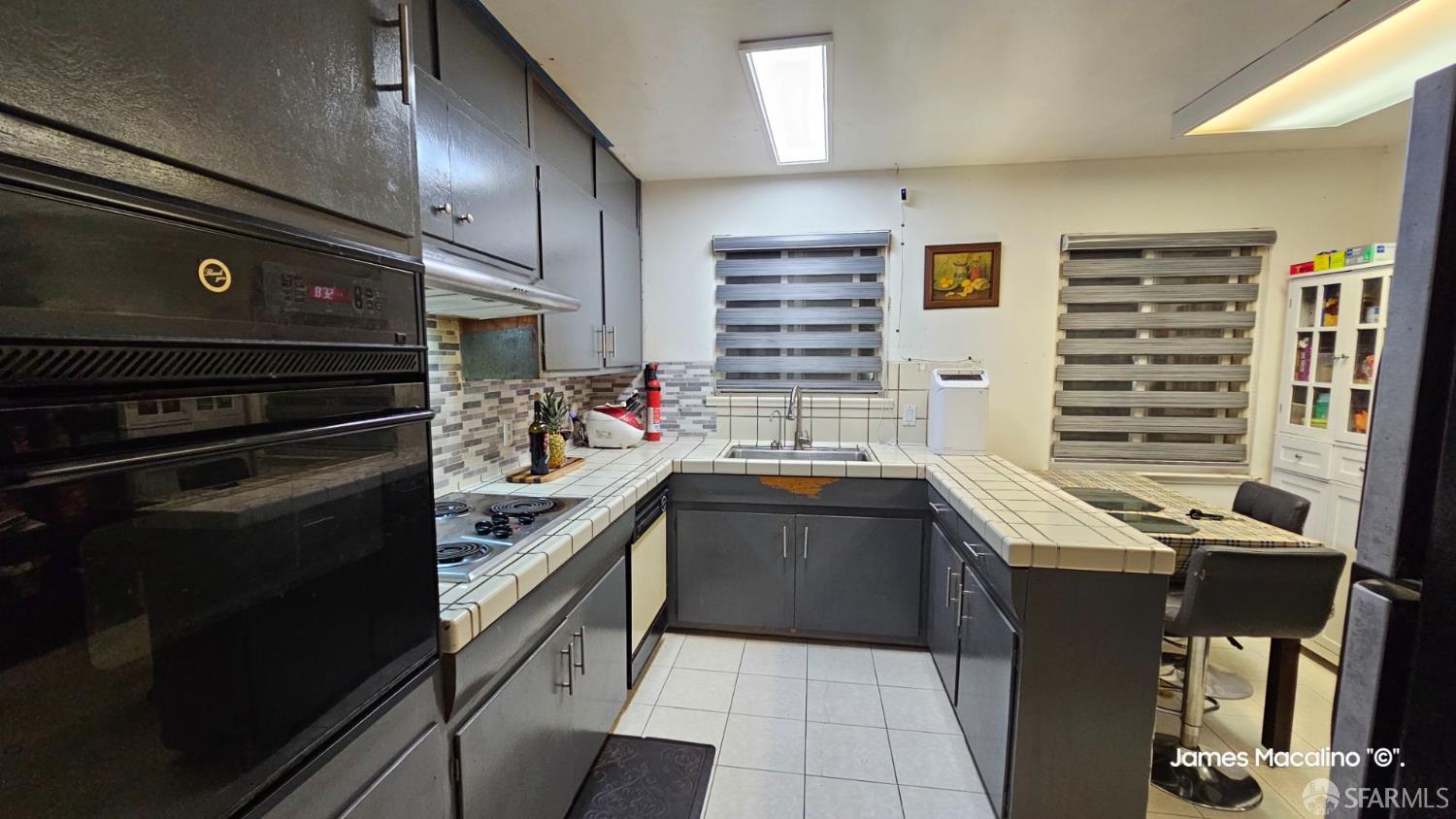 183 Mariposa Avenue Daly City, CA 94015 - Photo 21 of 27 a kitchen with a stove and a refrigerator