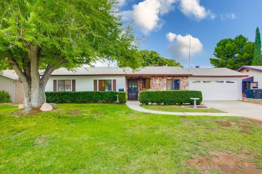 14574 Kennebunk Street Poway, CA 92064 - Photo 1 of 30 a view of a house with a big yard and palm trees