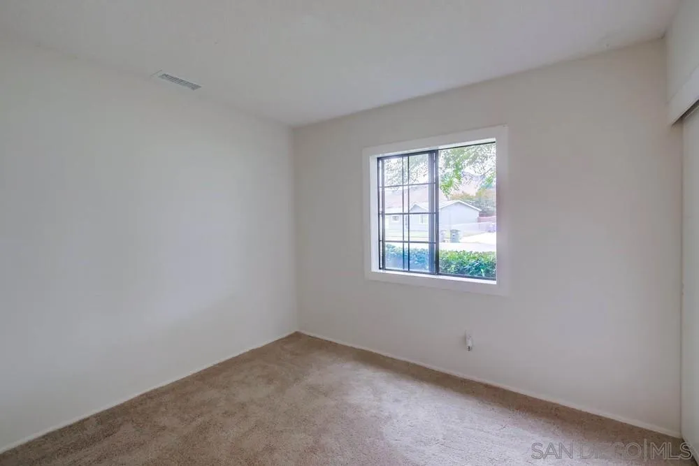 14574 Kennebunk Street Poway, CA 92064 - Photo 13 of 30 an empty room with a window
