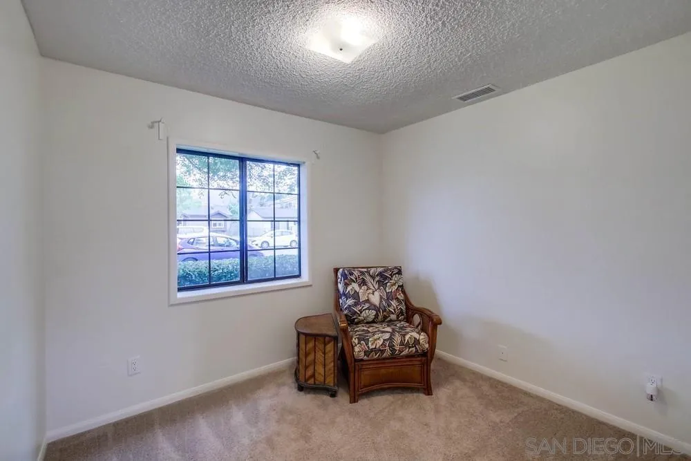 14574 Kennebunk Street Poway, CA 92064 - Photo 15 of 30 a living room with furniture and a window
