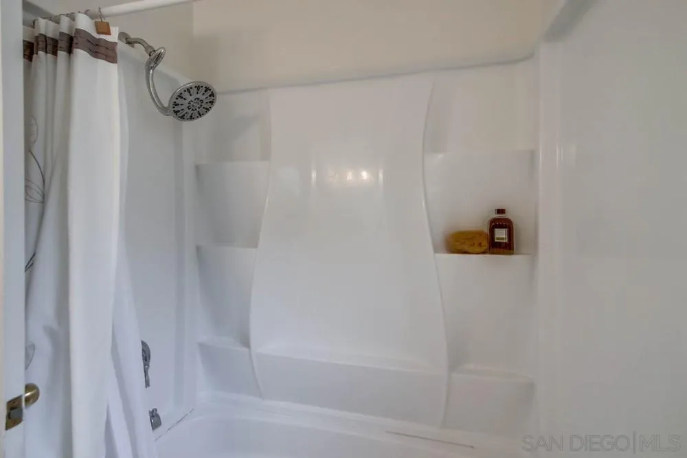 14574 Kennebunk Street Poway, CA 92064 - Photo 18 of 30 a bathroom with a shower