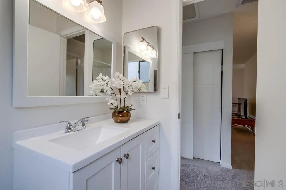 14574 Kennebunk Street Poway, CA 92064 - Photo 19 of 30 a bathroom with a sink and a mirror