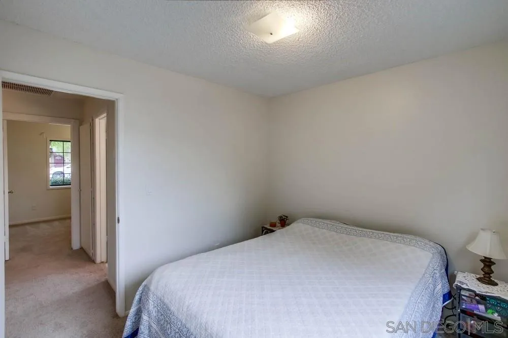 14574 Kennebunk Street Poway, CA 92064 - Photo 21 of 30 a bedroom with a bed and closet