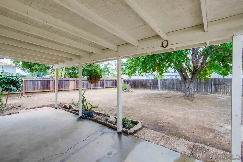 14574 Kennebunk Street Poway, CA 92064 - Photo 23 of 30 a view of a backyard with wooden fence