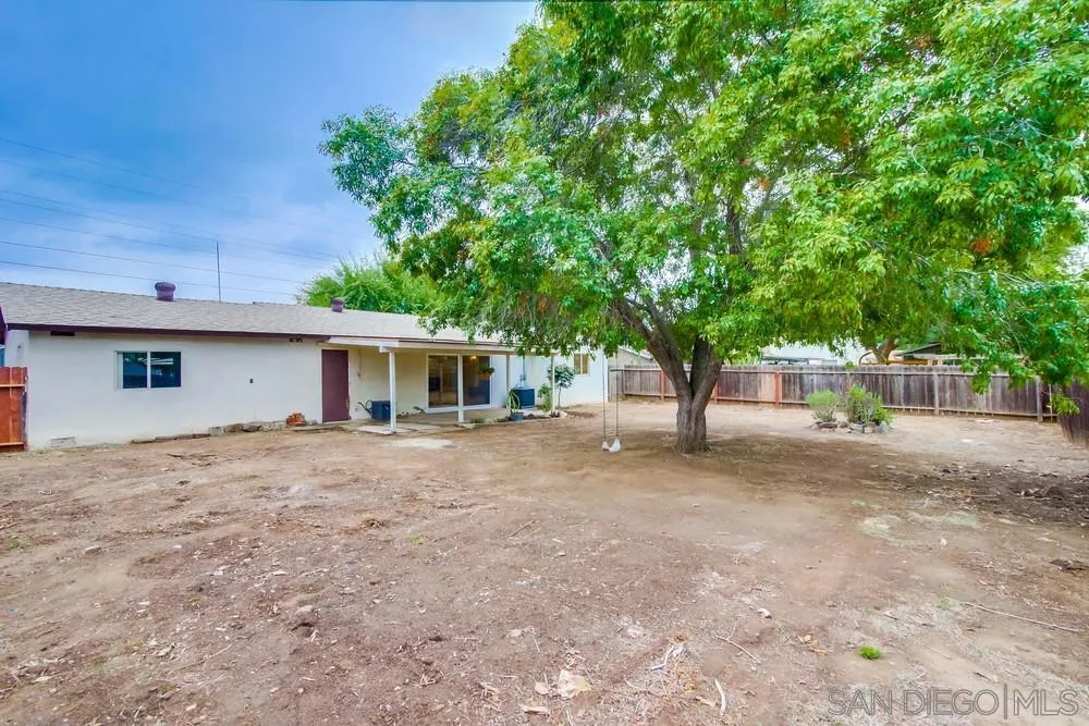 14574 Kennebunk Street Poway, CA 92064 - Photo 25 of 30 a front view of a house with a garden