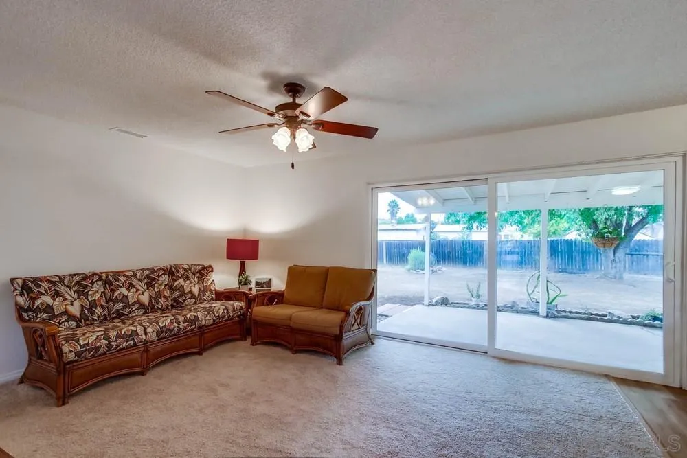 14574 Kennebunk Street Poway, CA 92064 - Photo 3 of 30 a living room with furniture and a large window