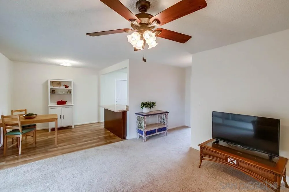 14574 Kennebunk Street Poway, CA 92064 - Photo 5 of 30 a living room with furniture and a flat screen tv