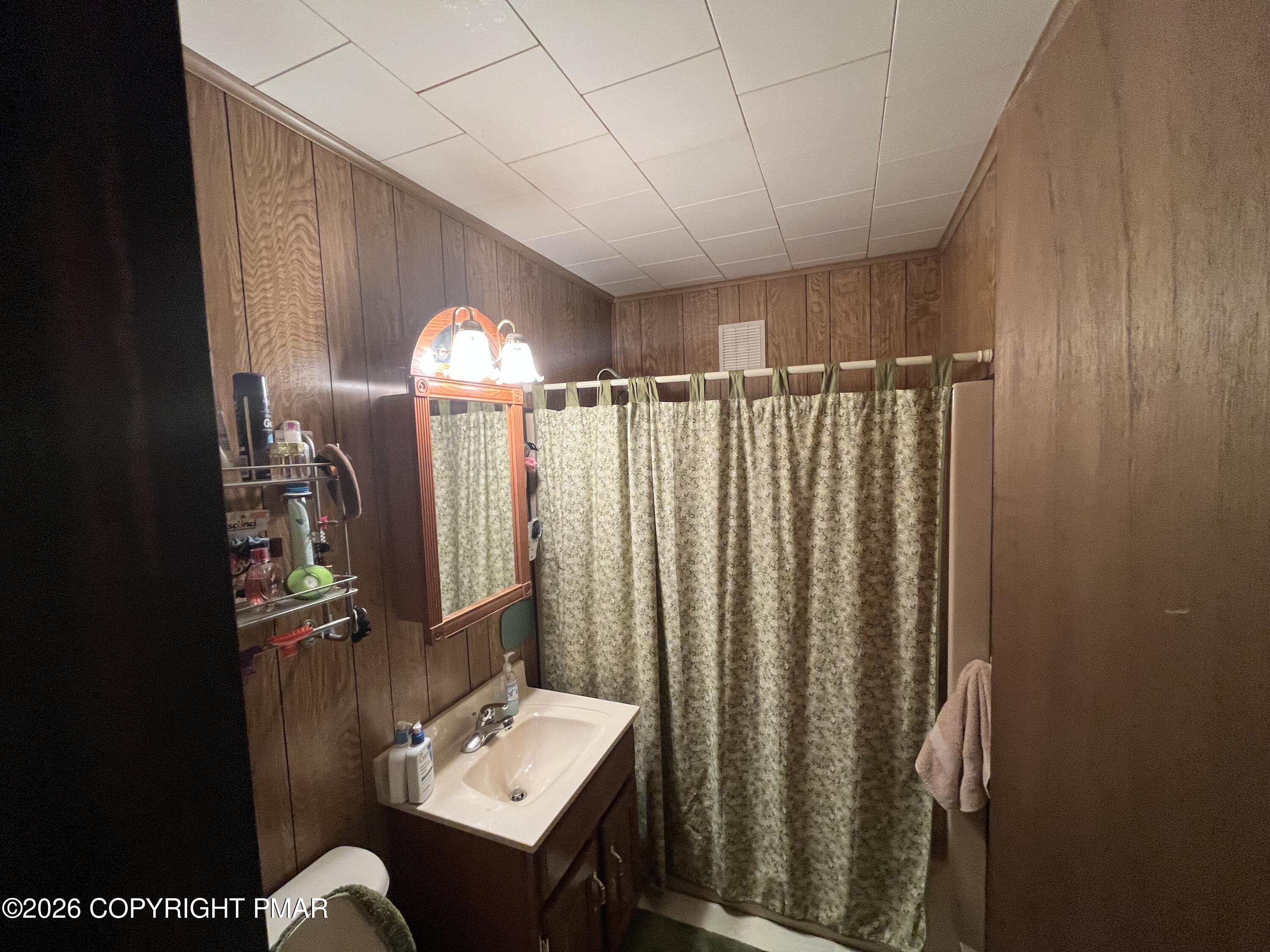 5970 Decker Road Bushkill, PA 18324 - Photo 21 of 26 a bathroom with a sink mirror and vanity
