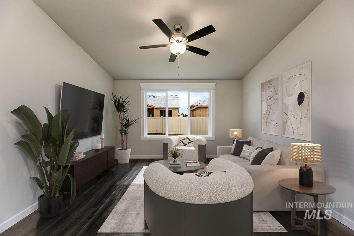 7080 South Gamely Avenue Meridian, ID 83642 - Photo 8 of 30 Living room featuring dark wood-type flooring and ceiling fan