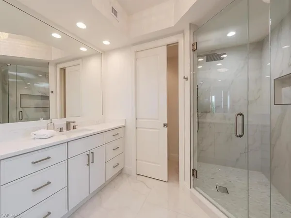 a bed room with bed and a window