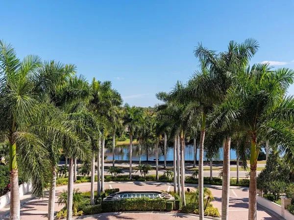 a balcony with table and chairs