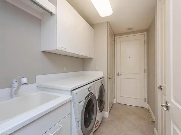 a dining room with furniture and a flat screen tv