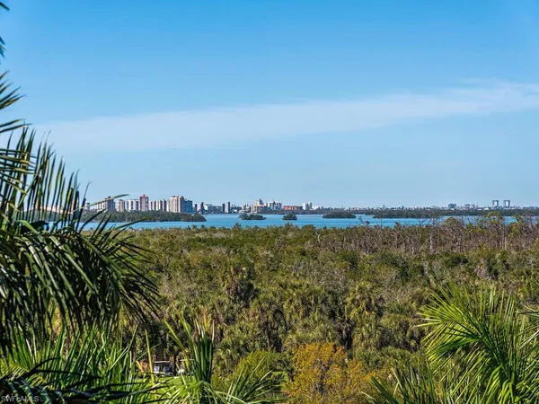 a living room with furniture a rug and a projector