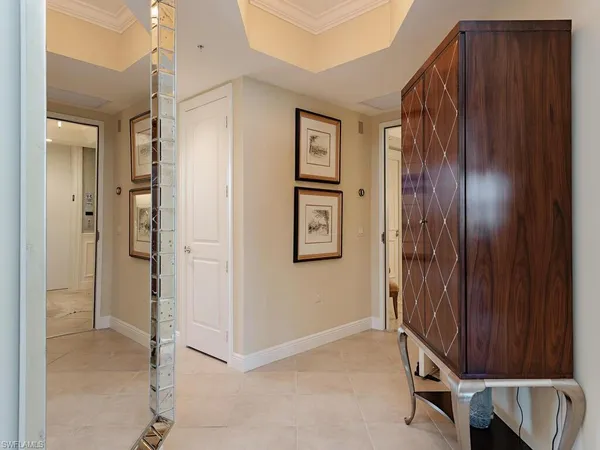 a large kitchen with kitchen island a sink stainless steel appliances and cabinets