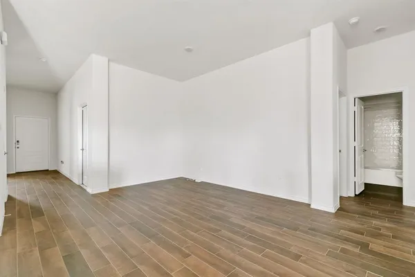 a view of a livingroom with wooden floor