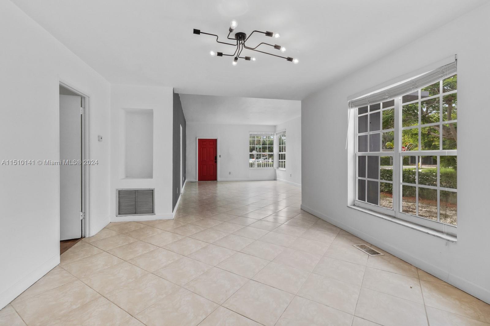 2037 Southwest 22nd Terrace Miami, FL 33145 - Photo 9 of 19 a view of an empty room with a window